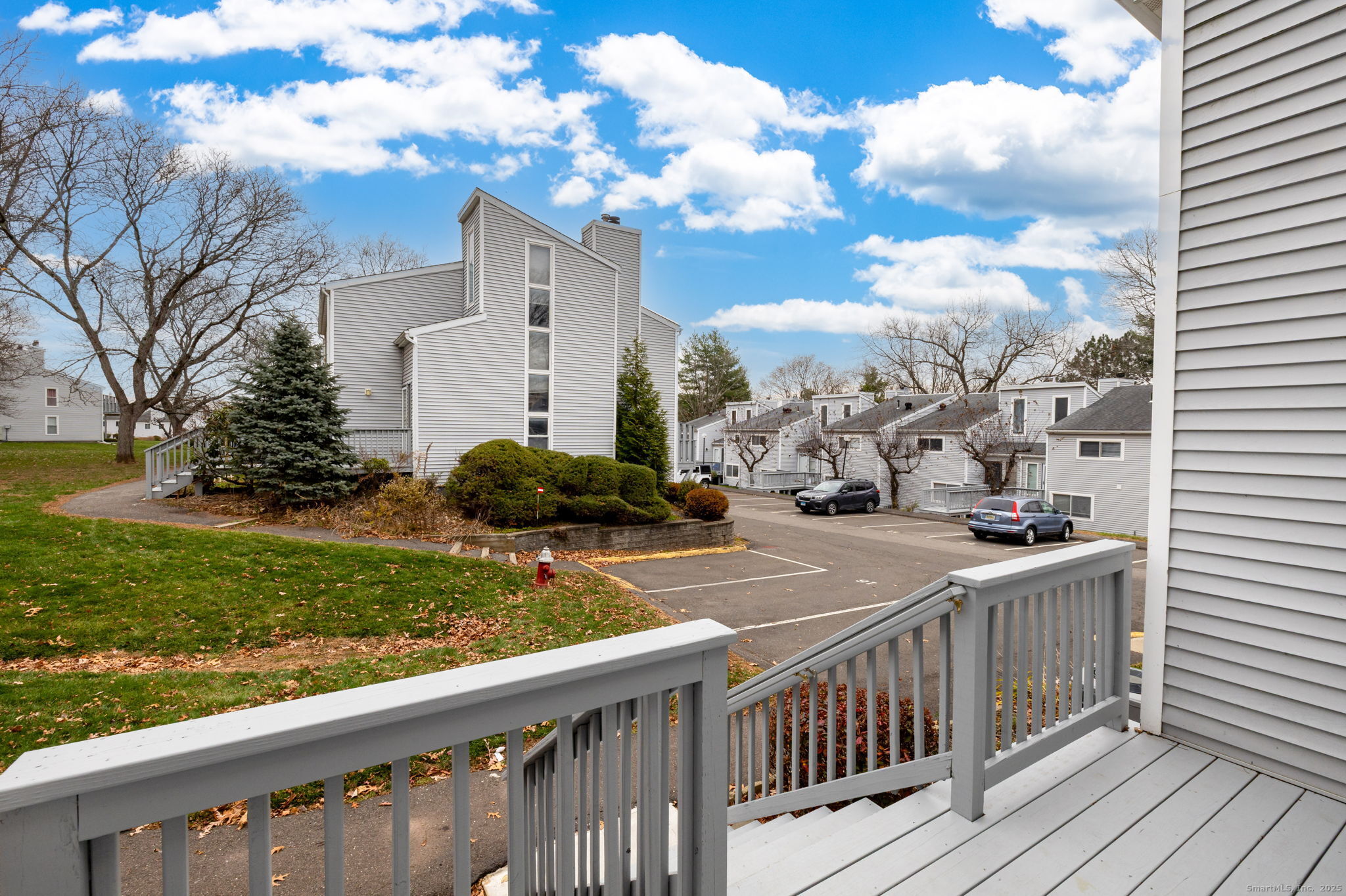 16 Springdale Road, Unit 16 Cromwell, CT 06416 - Photo 29 of 36 a view of a house with a wooden fence