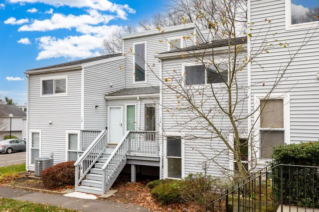 a front view of a house with stairs