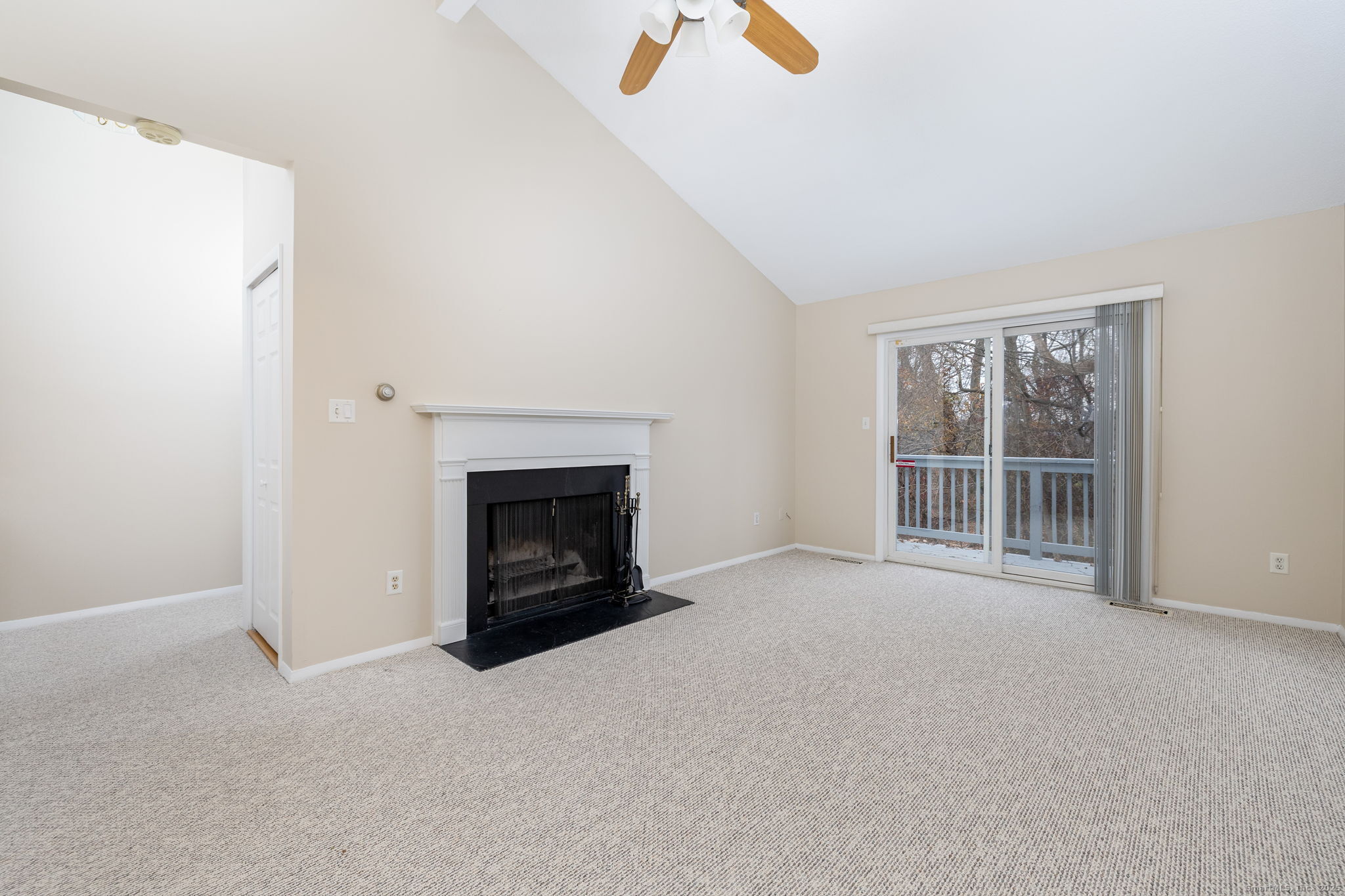 16 Springdale Road, Unit 16 Cromwell, CT 06416 - Photo 6 of 36 a view of an empty room with a fireplace and a window