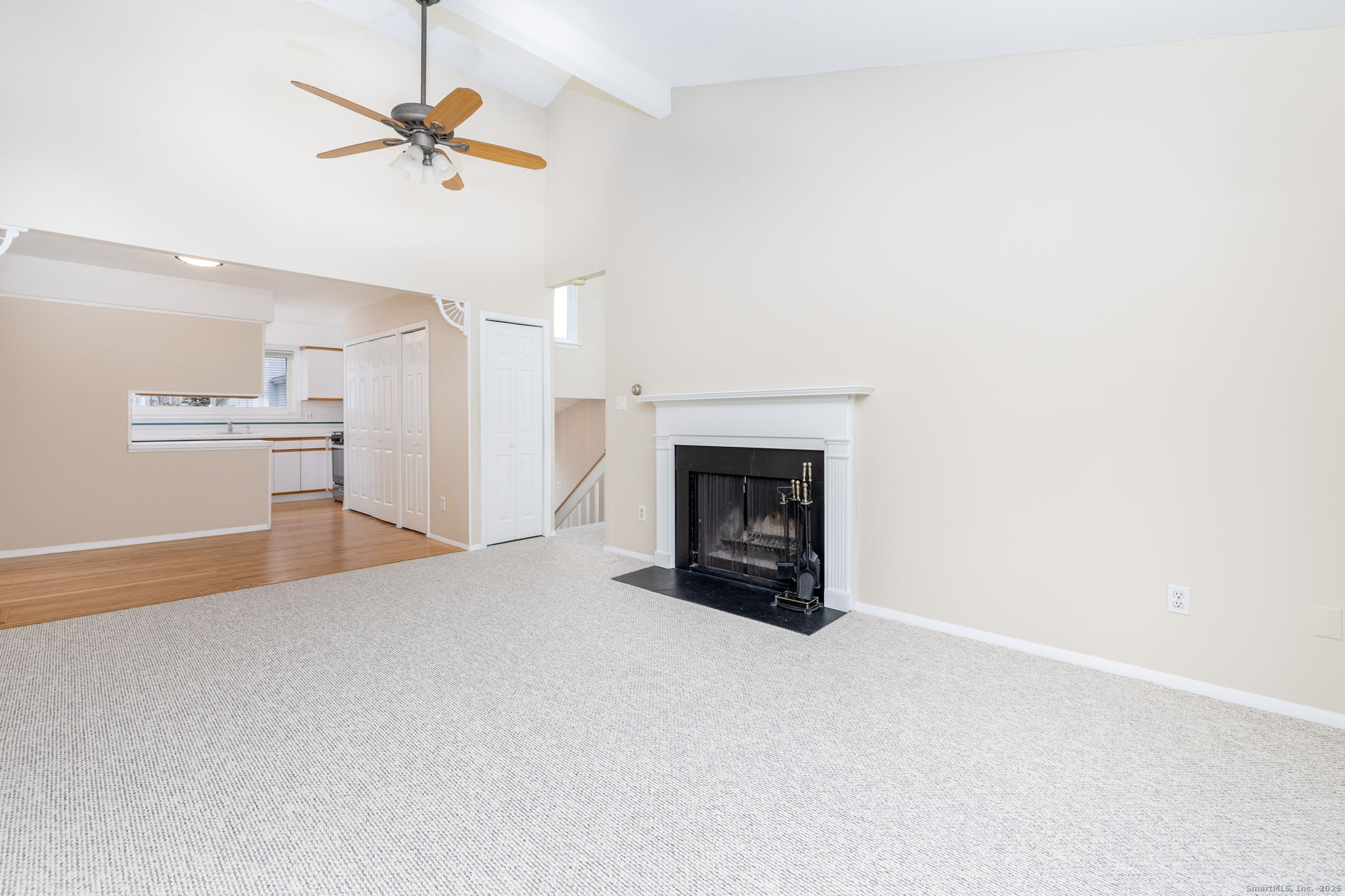 16 Springdale Road, Unit 16 Cromwell, CT 06416 - Photo 7 of 36 a view of a livingroom with a fireplace and a ceiling fan