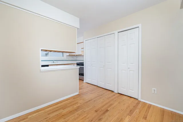 a view of a kitchen with wooden floor