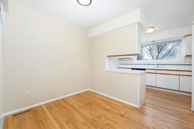 a view of kitchen with wooden floor