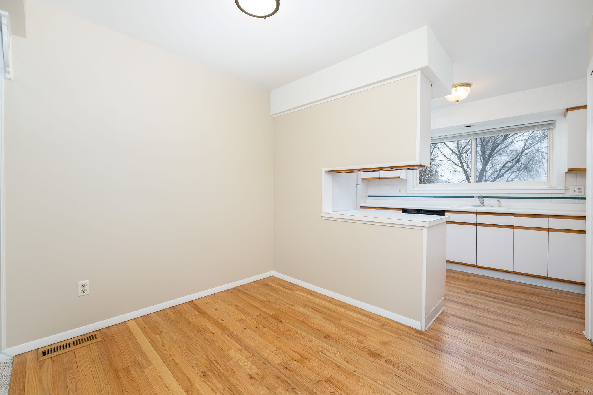 16 Springdale Road, Unit 16 Cromwell, CT 06416 - Photo 10 of 36 a view of kitchen with wooden floor