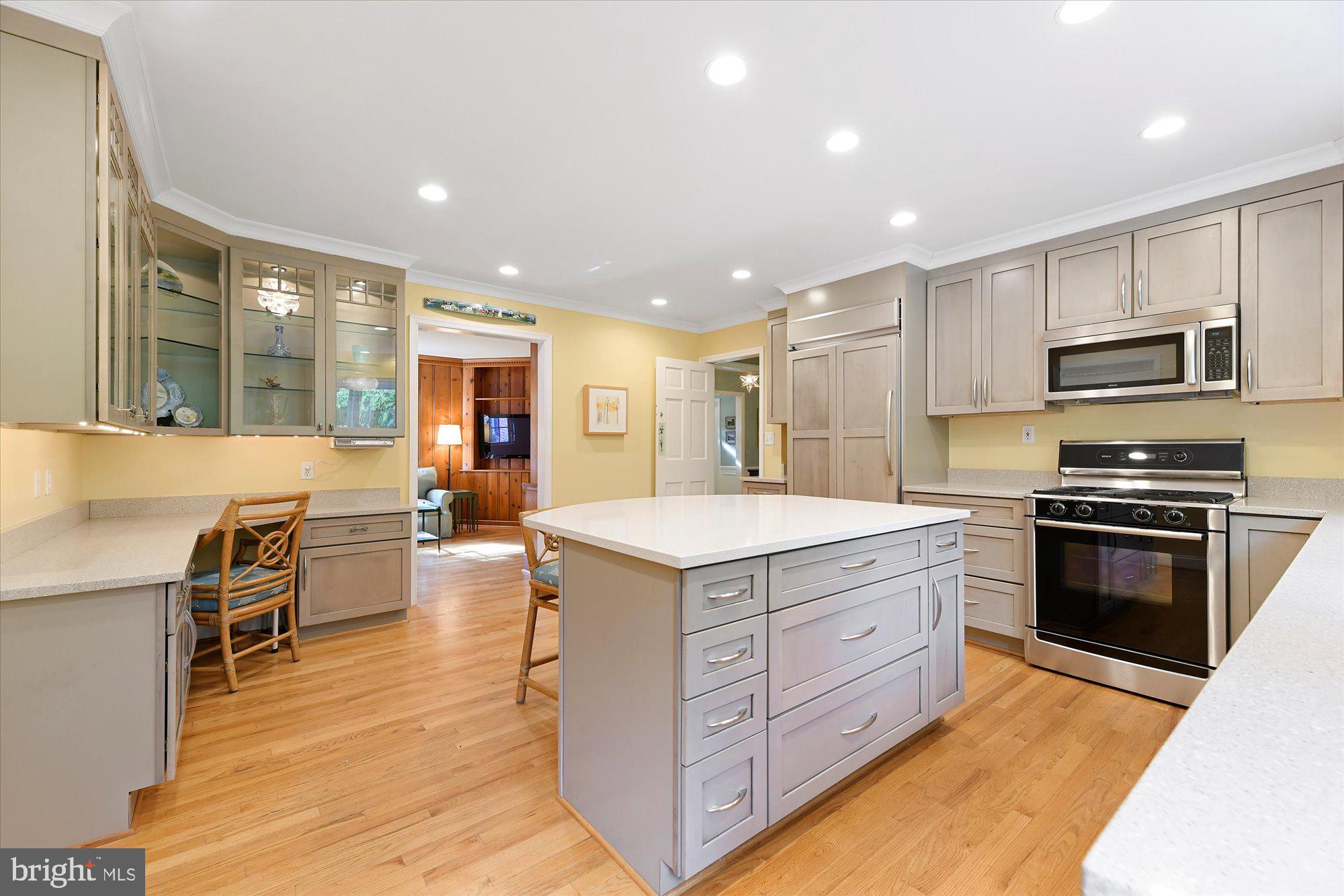 102 Castlewood Road Baltimore, MD 21210 - Photo 23 of 74 The kitchen opens up to the beautiful paneled den