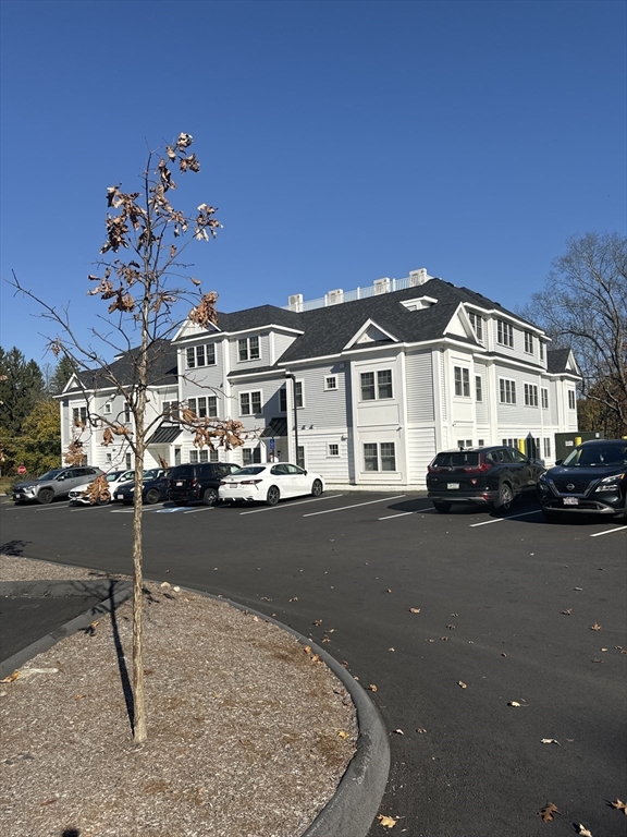 23 Prentice Street, Unit 2205 Grafton, MA 01536 - Photo 2 of 8 a view of a house with a patio