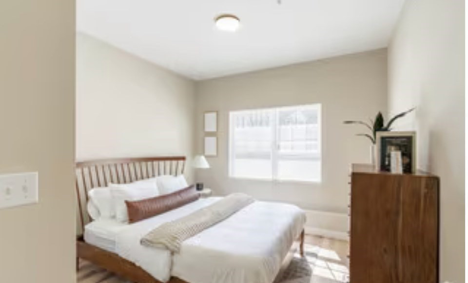 23 Prentice Street, Unit 2205 Grafton, MA 01536 - Photo 5 of 8 a bedroom with a bed and a couch