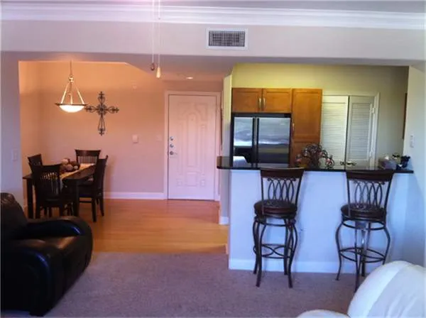 a view of a livingroom with furniture and a piano