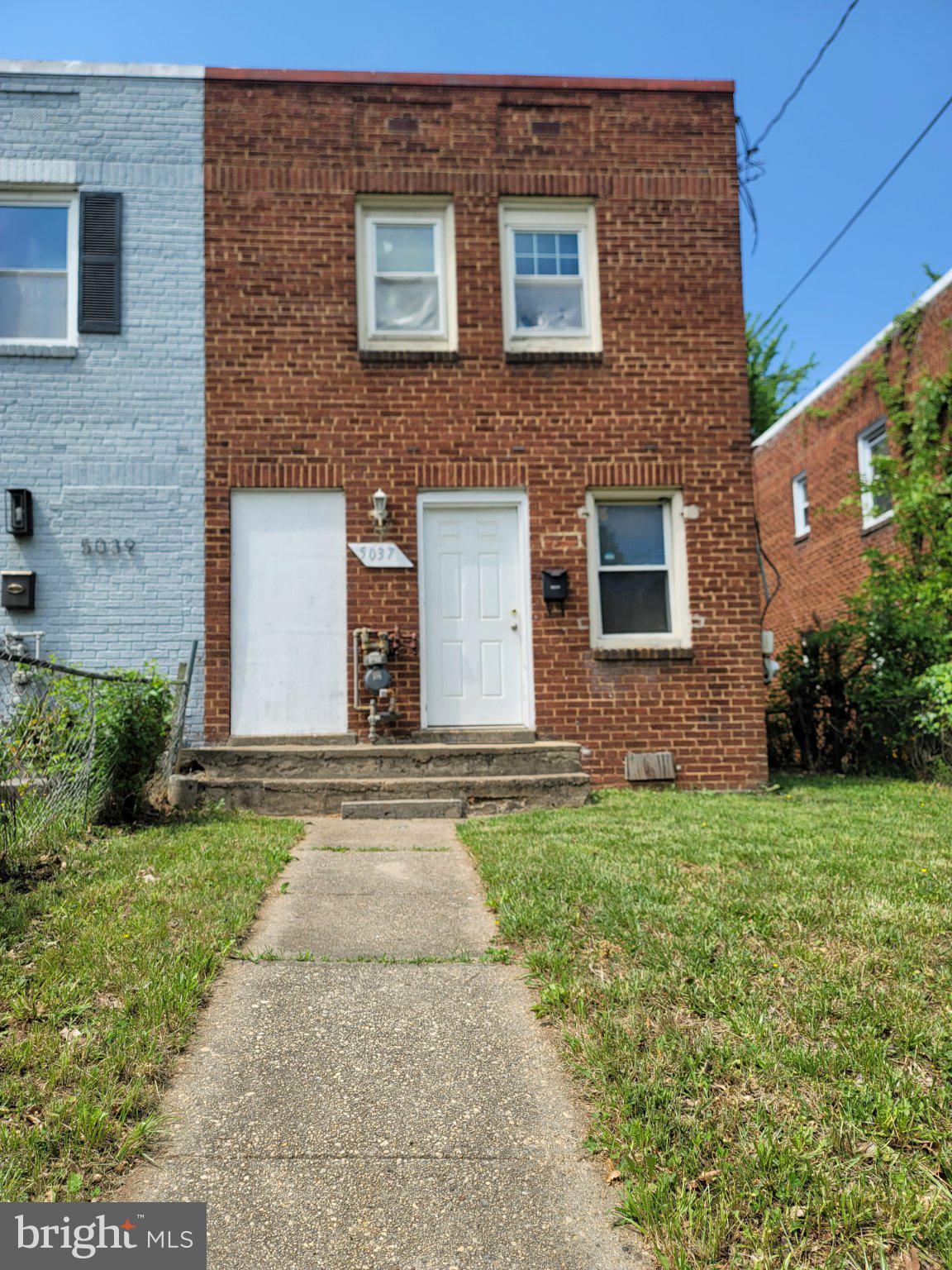 5037 Benning Road Southeast Washington, DC 20019 - Photo 2 of 13 Charming brick duplex with inviting entry.