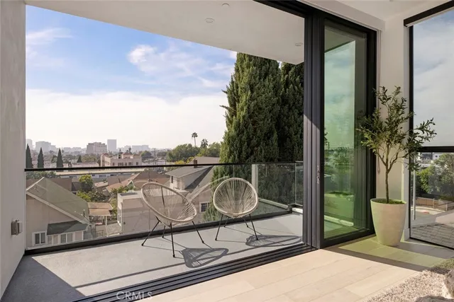 a kitchen with a table chairs and a window