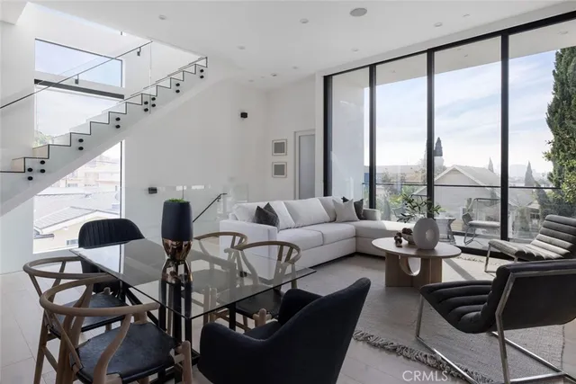 a kitchen with a window appliances and cabinets