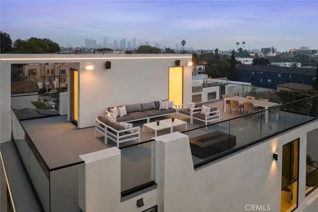 a view of a chairs and table in a terrace