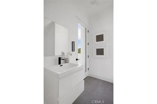 a bathroom with a glass shower door