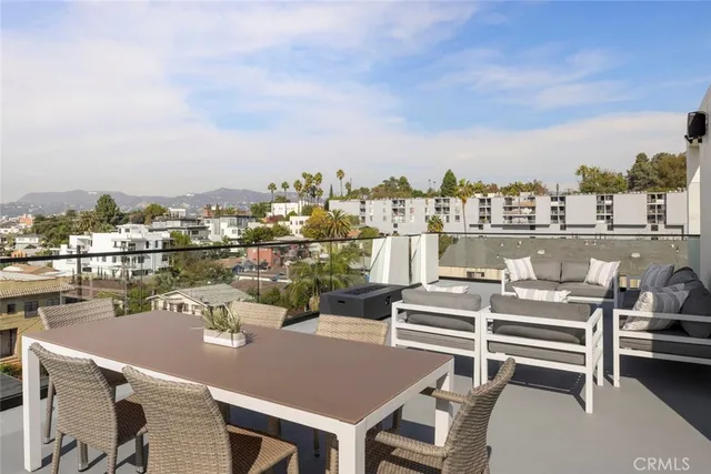 a kitchen with a sink refrigerator and cabinets