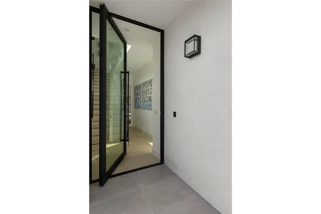 a bathroom with a glass shower door