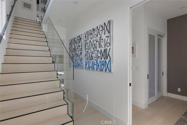 a bedroom with a bed and a potted plant
