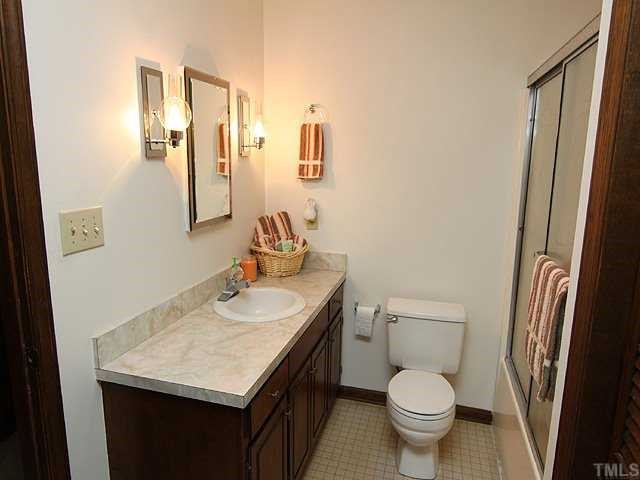 5290 Hurdle Mills Road Roxboro, NC 27574 - Photo 12 of 25 Hall bathroom which services the two additional bedrooms.