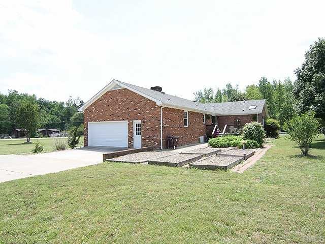 5290 Hurdle Mills Road Roxboro, NC 27574 - Photo 13 of 25 Large two car garage (side-entry) with plenty of additional parking space; raised planting/vegetable beds.