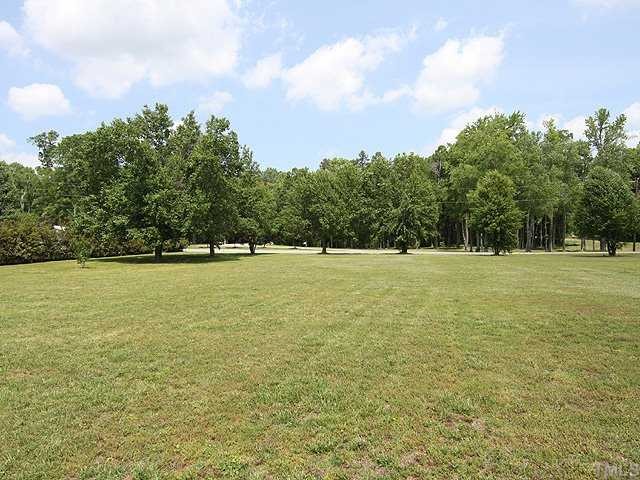 5290 Hurdle Mills Road Roxboro, NC 27574 - Photo 14 of 25 Beautiful lawn/gardens in the back of the home.