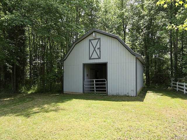 5290 Hurdle Mills Road Roxboro, NC 27574 - Photo 22 of 25 Smaller stable and pasture has two stalls, tack room, loft. Separately fenced pasture.