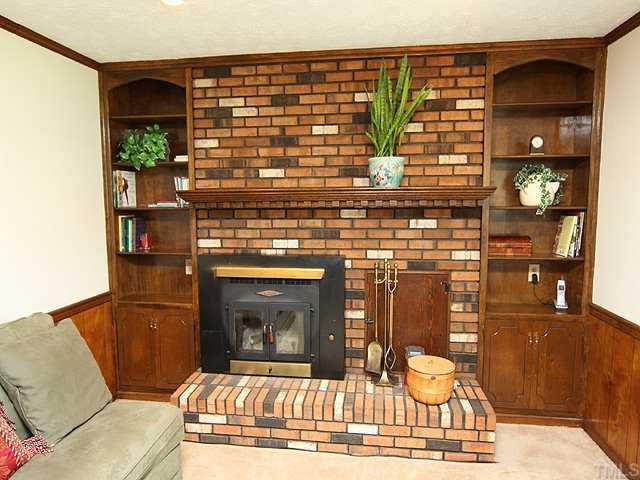 5290 Hurdle Mills Road Roxboro, NC 27574 - Photo 2 of 25 Efficient wood burning stove in this cozy and comfortable Family Room.
