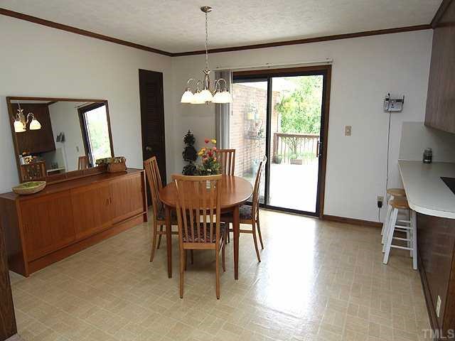 5290 Hurdle Mills Road Roxboro, NC 27574 - Photo 3 of 25 Dining area right off kitchen and living room....walk out to large deck