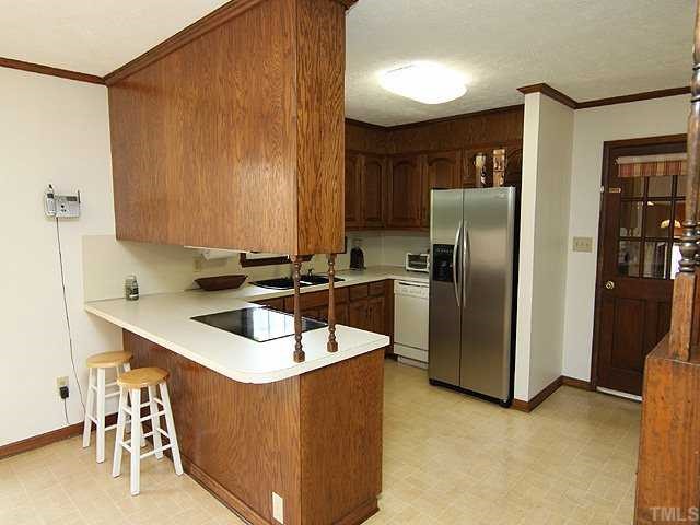 5290 Hurdle Mills Road Roxboro, NC 27574 - Photo 4 of 25 Bright, fresh, efficient kitchen with stainless steel appliances.