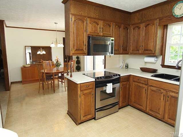 5290 Hurdle Mills Road Roxboro, NC 27574 - Photo 5 of 25 Open and cheerful kitchen looking through to the breakfast/dining room.