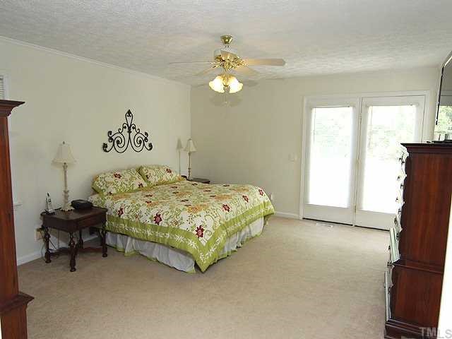 5290 Hurdle Mills Road Roxboro, NC 27574 - Photo 6 of 25 Master bedroom with plenty of space and a large walk-in closet. This was added on shortly after the home was built.