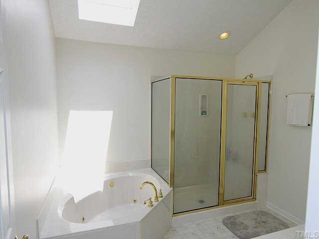 5290 Hurdle Mills Road Roxboro, NC 27574 - Photo 8 of 25 Lovely master bath with skylight which illuminates the space.