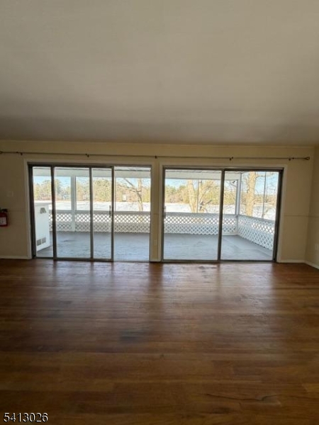 113 D North Shore Point Montague, NJ 07827 - Photo 8 of 18 a view of an empty room with wooden floor and a window