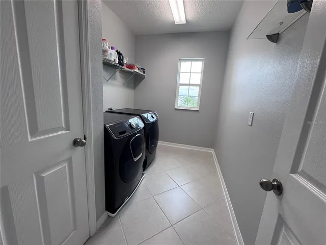 a view of a utility room with washer and dryer