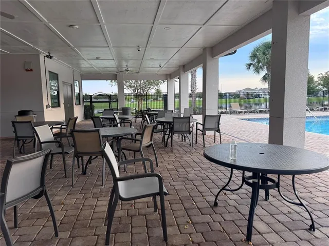 a view of a dining room with furniture window and outside view