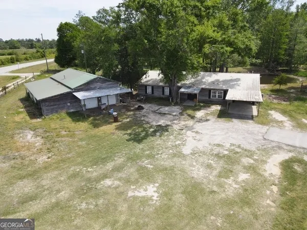 swimming pool view with a seating space
