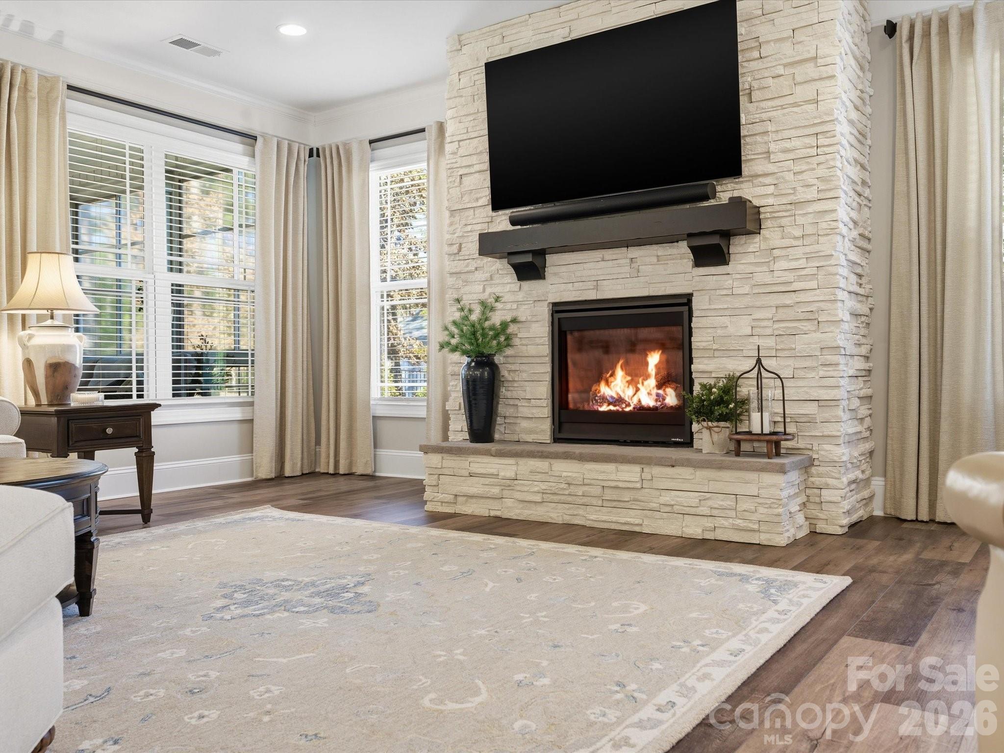 4166 Persimmon Road Lancaster, SC 29720 - Photo 8 of 41 a living room with a fireplace furniture and a flat screen tv