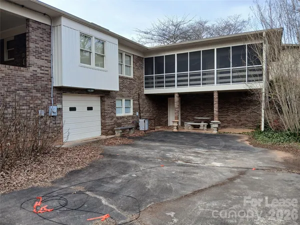 a view of the house with large windows