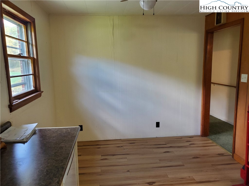 1411 Cabbage Creek Road Creston, NC 28615 - Photo 12 of 41 a view of room with window and wooden floor