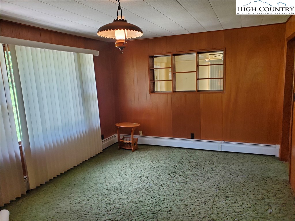 1411 Cabbage Creek Road Creston, NC 28615 - Photo 13 of 41 a view of a livingroom with a fireplace