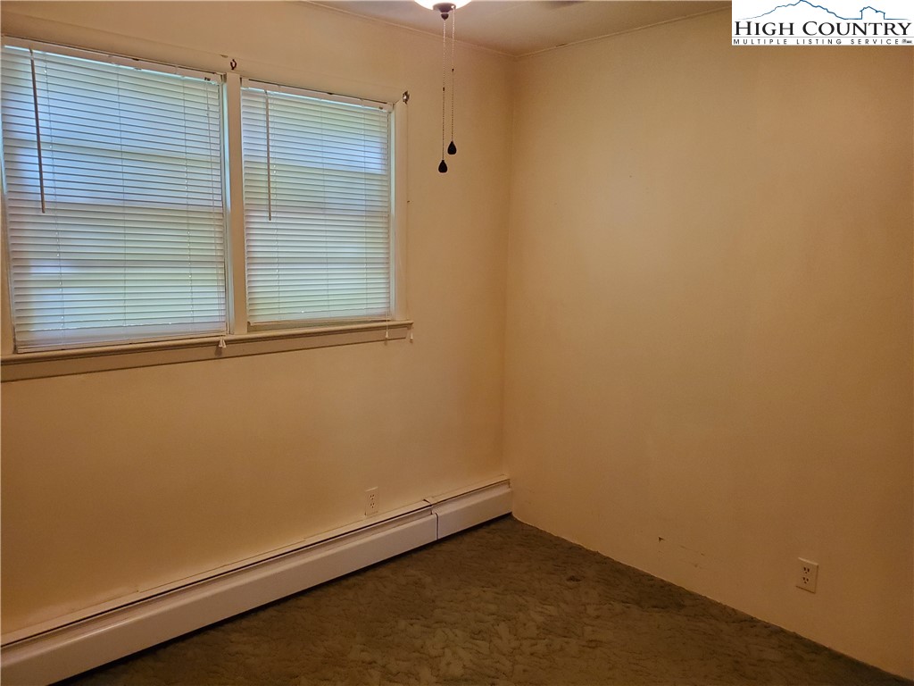 1411 Cabbage Creek Road Creston, NC 28615 - Photo 15 of 41 an empty room with a window