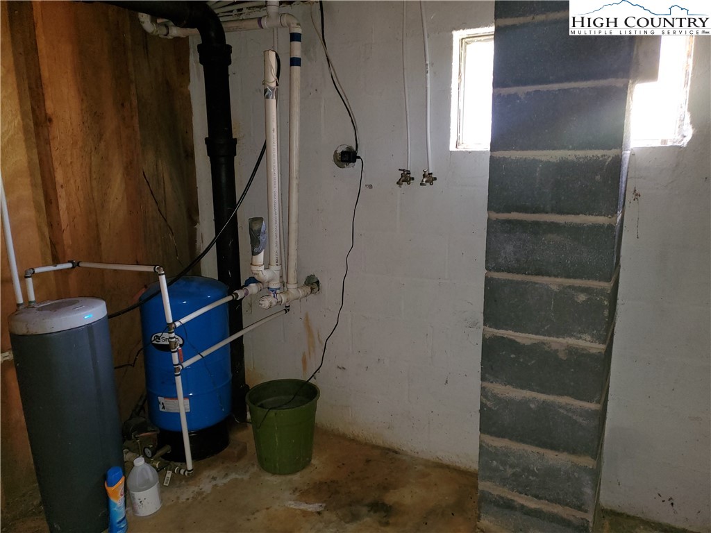 1411 Cabbage Creek Road Creston, NC 28615 - Photo 20 of 41 a view of storage and utility room with two washing machine