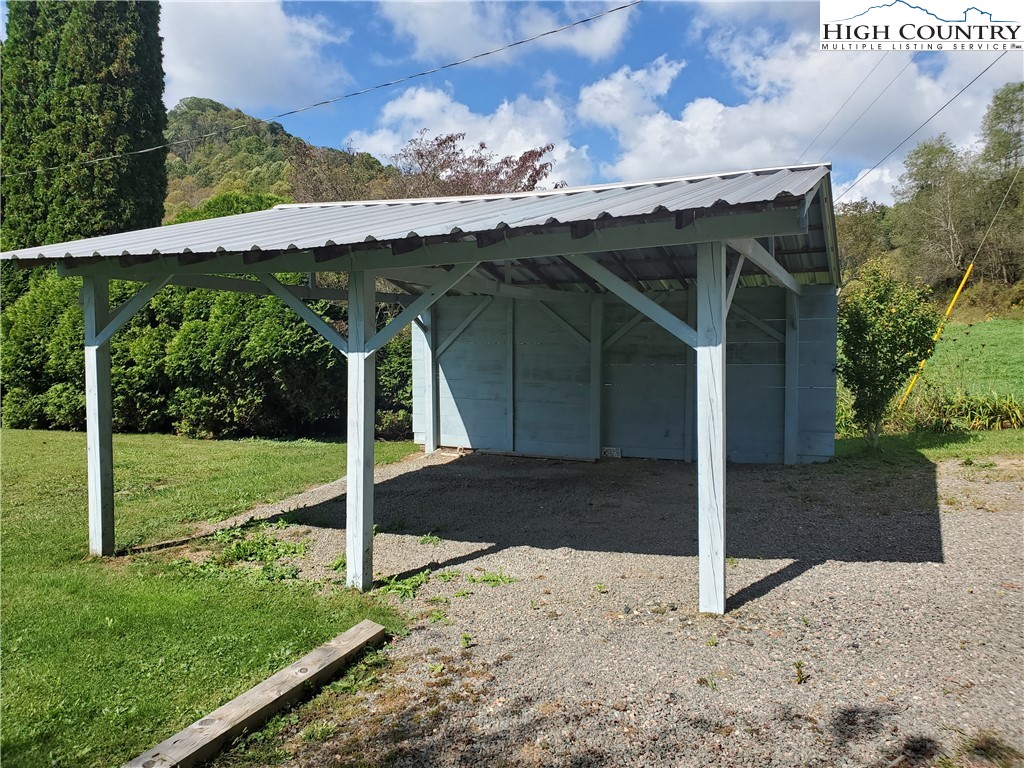 1411 Cabbage Creek Road Creston, NC 28615 - Photo 23 of 41 a view of a house with backyard and garden
