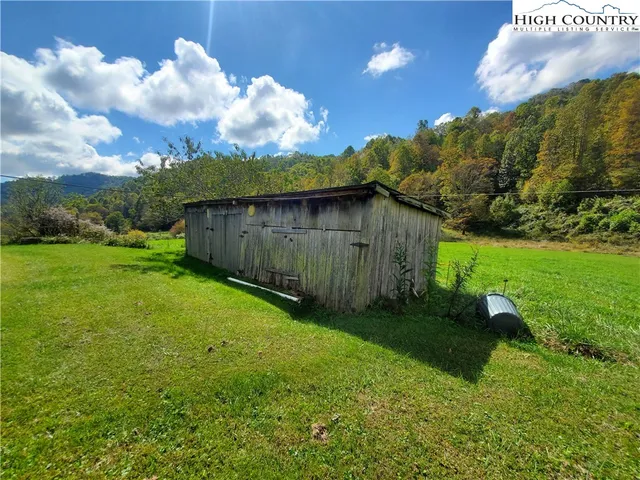 a view of a big house with a big yard