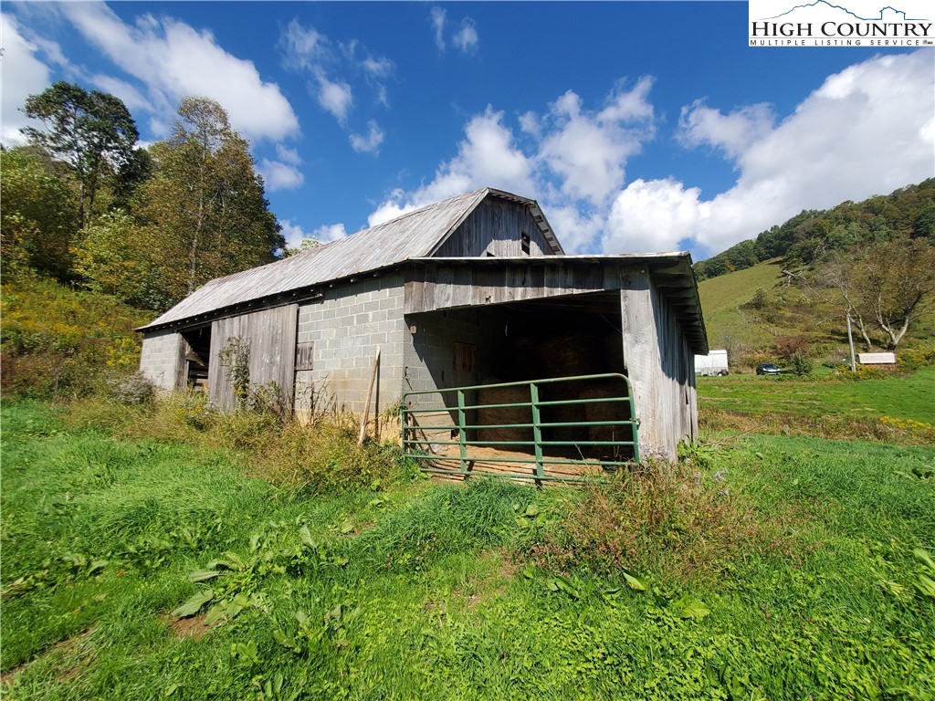 1411 Cabbage Creek Road Creston, NC 28615 - Photo 25 of 41 a backyard of a house with lots of green space