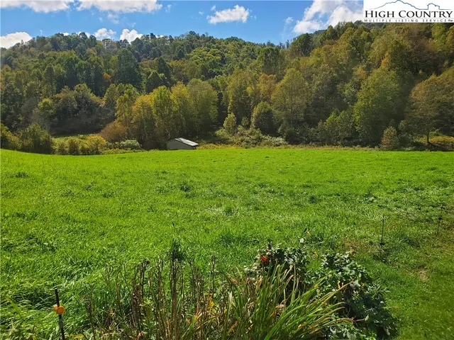 a view of a golf course with a house