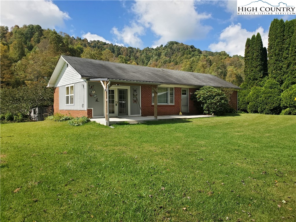 1411 Cabbage Creek Road Creston, NC 28615 - Photo 7 of 41 a front view of house with yard and green space