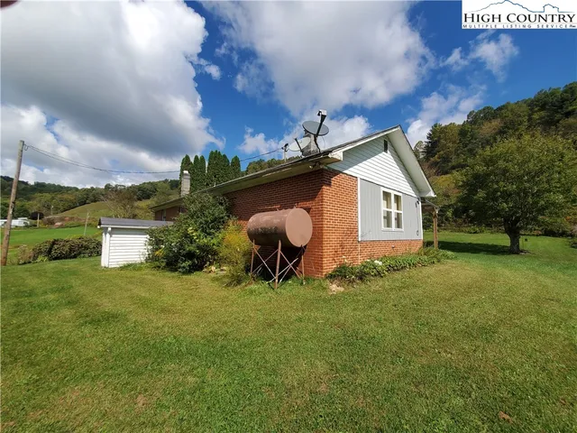 a view of room with window and wooden floor