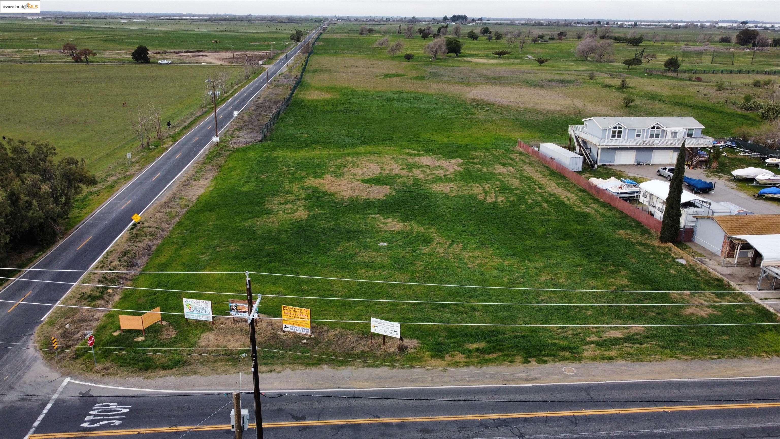 a view of a tennis ground with a yard