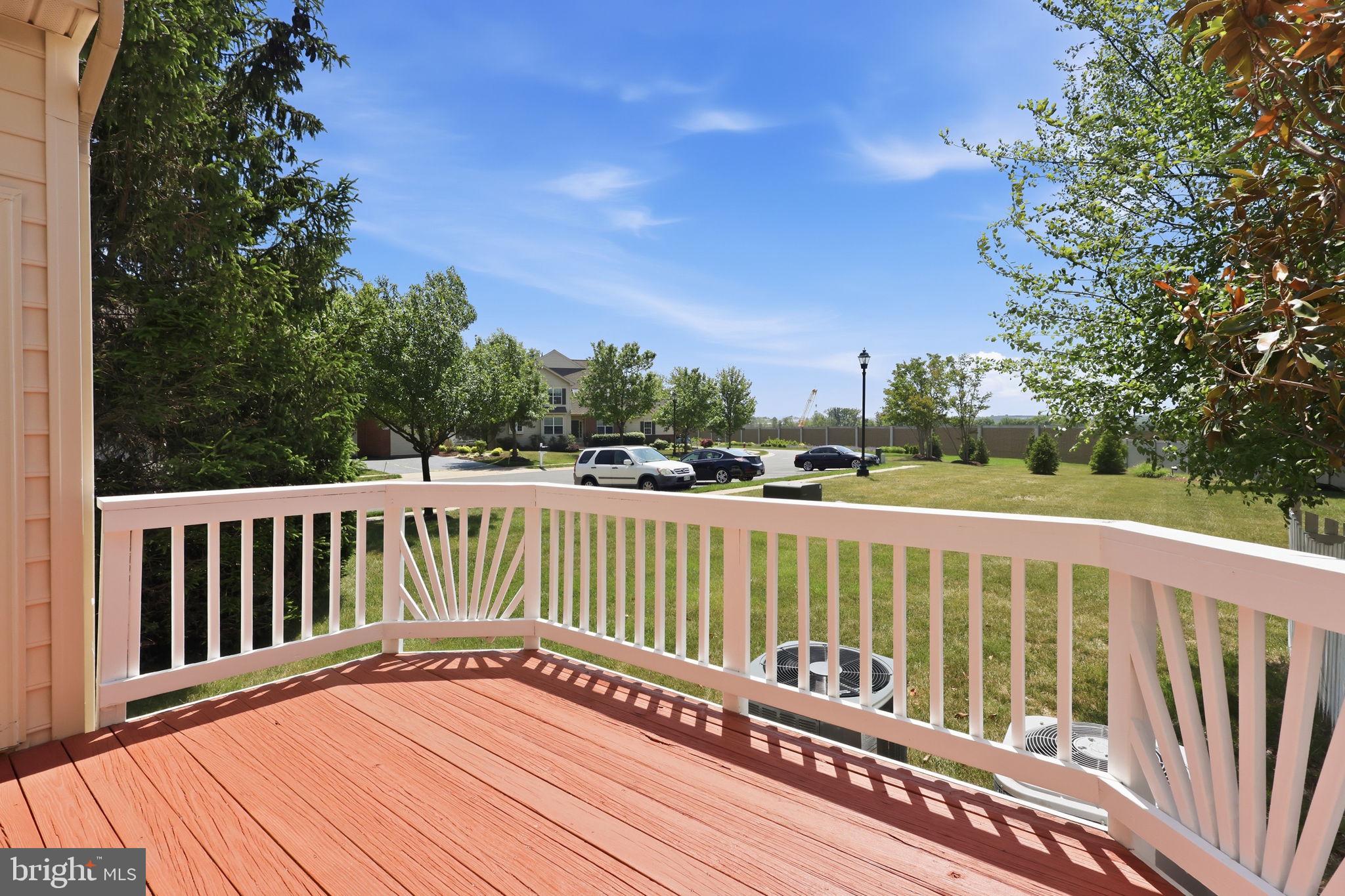 19617 Edgemont Square Ashburn, VA 20147 - Photo 54 of 65 a balcony with wooden floor and fence