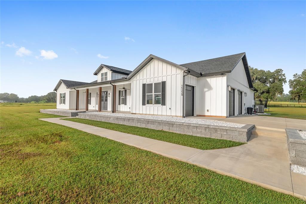 15224 Northwest 56th Court Road Reddick, FL 32686 - Photo 11 of 50 a house with swimming pool in front of it