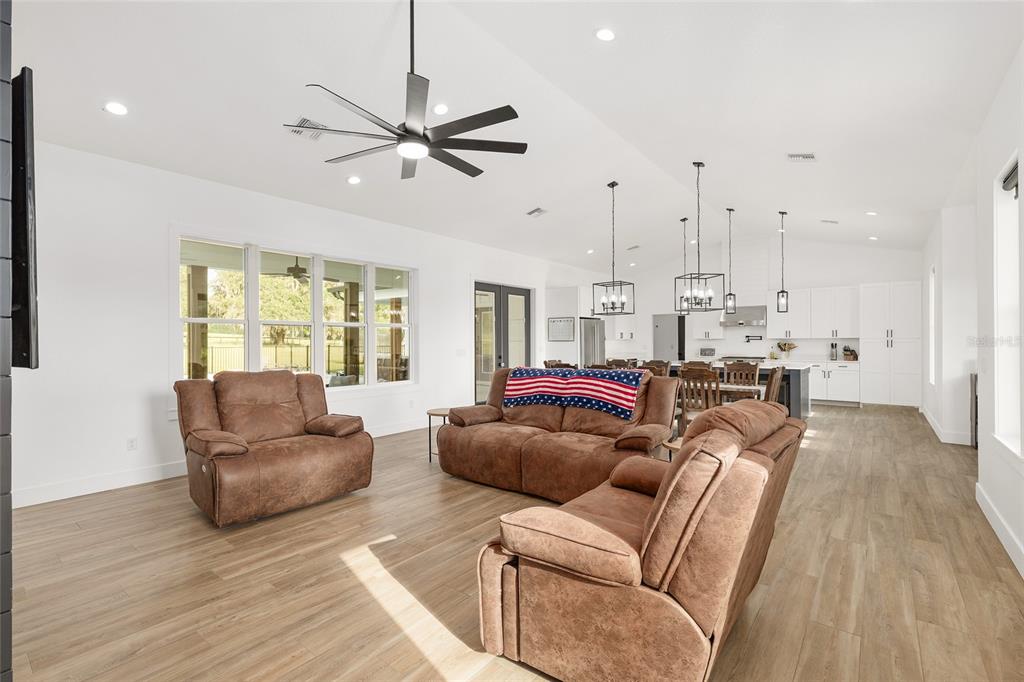 15224 Northwest 56th Court Road Reddick, FL 32686 - Photo 16 of 50 a living room with furniture and a wooden floor