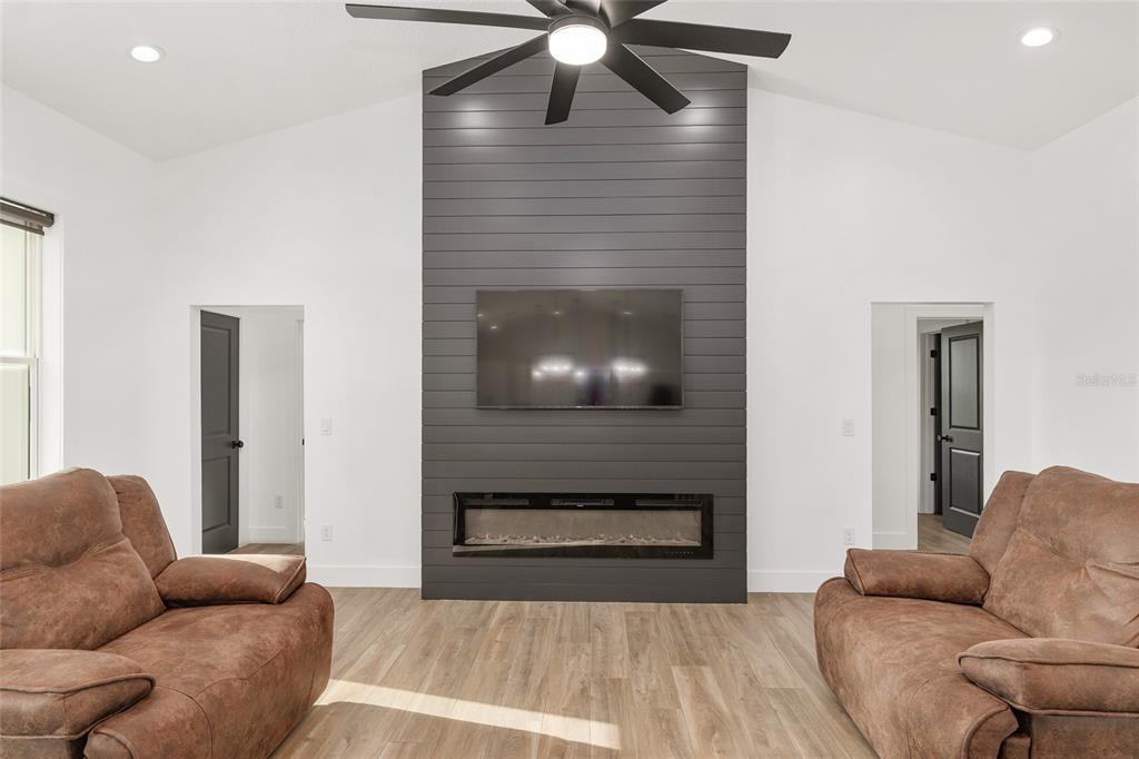 15224 Northwest 56th Court Road Reddick, FL 32686 - Photo 18 of 50 a living room with furniture and a fireplace